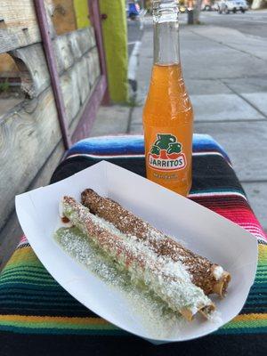 Barbacoa flautas (one with green sauce and one with the smokey red sauce)