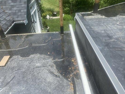 Not waiting for the adhesive to cure before applying rubber roof, resulting in excessive bubbling