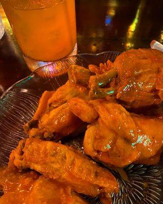 Chicken Wings, with Cholula buffalo sauce, house ranch dressing and house blue cheese.  They cure them, confit them, and then fry to order.