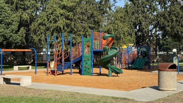 2 playgrounds, wood chips, partial shade, parking