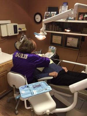 One of our dental hygienists cleaning teeth.