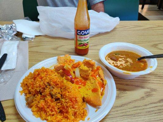 Yellow rice and sausage with a side of beans