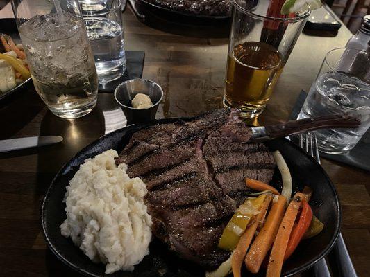 Porterhouse mashed potato's vegetable medley and cowboy butter.