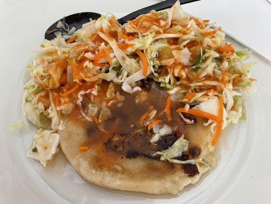 Jalapeño pupusa with cabbage and red sauce