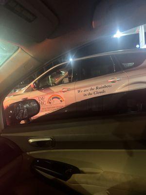 On her phone while driving a company vehicle  after almost hitting me