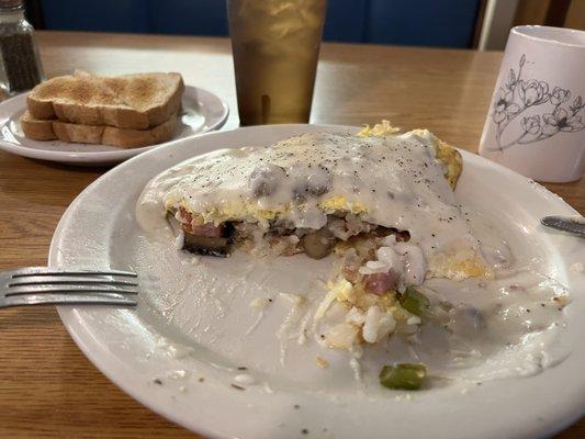 Half eaten monster omelette. Amazing...it's like ordering a sampler of everything on the menu!