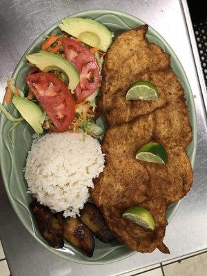 Breaded chicken with rice, salad and my side of sweet plantains. Delicious