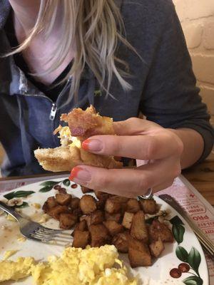 This girl makes herself little sammies with the smorgasbord of breakfast fare!