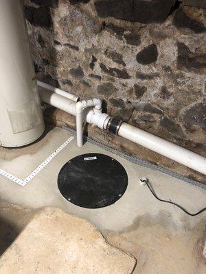 Sump Container/Sump Pump with Discharge Line tied in Sewer Pipe