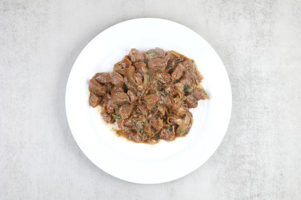 STEWED BEEF sauteed with Earthly Spices, Onions and topped with Cilantro