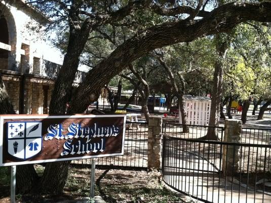 Front of the school and main playground under the shady oaks