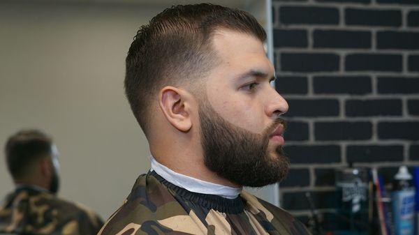 Low skin fade with beard enhancement. Done by Eric Gabrielson