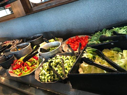 Salad bar has been "upgraded". I like the labels, and I like the chopped cucumber over the large discs. 1 Dressing had no spoon whole time.