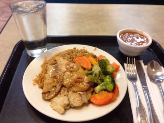 Chicken breast , veggies and rice a beans , decent portion