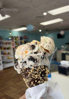 Munchie madness on a chocolate dipped cone with nuts