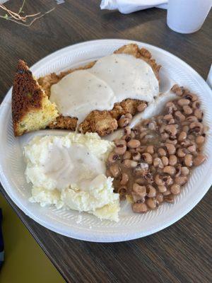 Fried tenderized pork loin, mashed potatoes, black eyed peas and jalapeno cornbread.