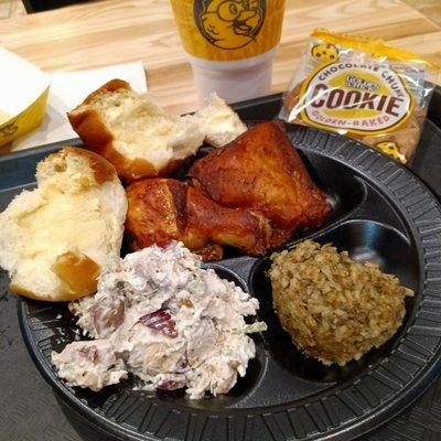 2 PC roasted chicken dinner, dirty rice, biscuit, and side of chicken salad. My favorite things. The cookie was a freebie for the wait.