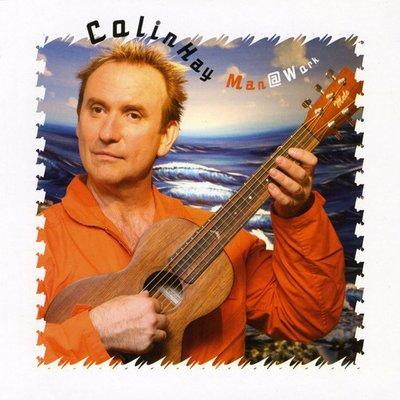 Colin Hay with his "baby", a Mele Ukulele mahogany guitarlele, on the cover of his awesome cd, Man @ Work.