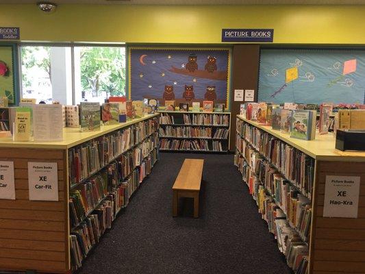 Clean and organized bookshelves in the kids section