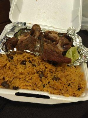 Fried Pork Spanish dinner with yellow rice and peas