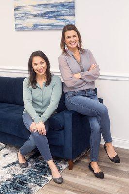 Lisa and Isabel, ARK team members sitting on the couch