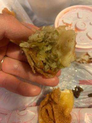 Piece of the egg roll. The inside was not appealing and tasted old