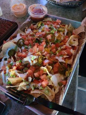 Sloppy nachos,  a cocktail,  wings, and friends.  Happy hour