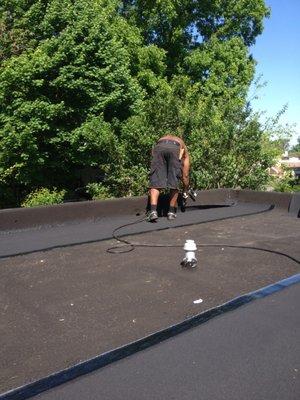 torch down flat rubber roof installation