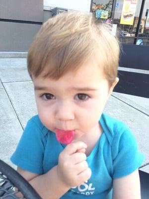 Enjoying his sucker after his haircut.