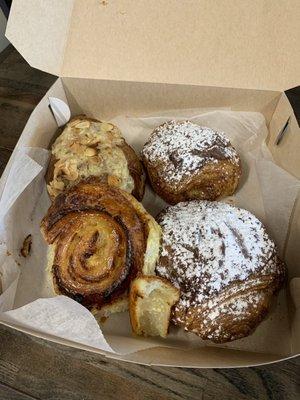 Pictured: two Nutella croissants, a raisin roll thing, and a creamy almond croissant.