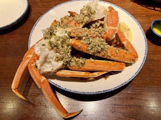 1lb of Bairdi Crab covered in Roasted Garlic butter over crispy fried potatoes.  Delicious, but messy.