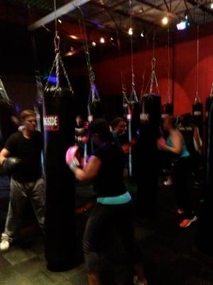 Cardio Kickboxing using 6ft 100lb Muay Thai bags.