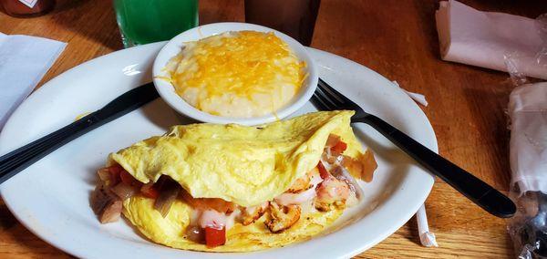 Cajun omelette and cheese grits