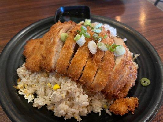 Fried chicken over fried rice.