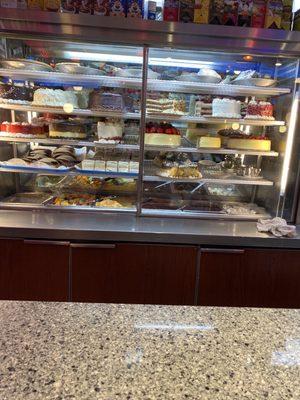 Many delicious desserts in the refrigerated case