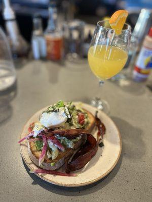 Avocado toast add bacon and poached egg + mimosa