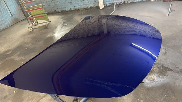 Tesla hood repaint after replacement.