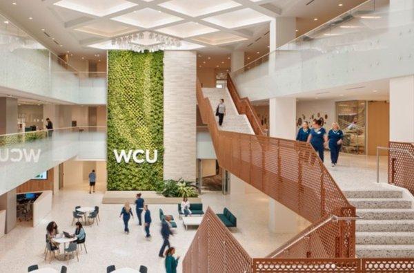 Wide shot of the WCU-Texas lobby/atrium area.