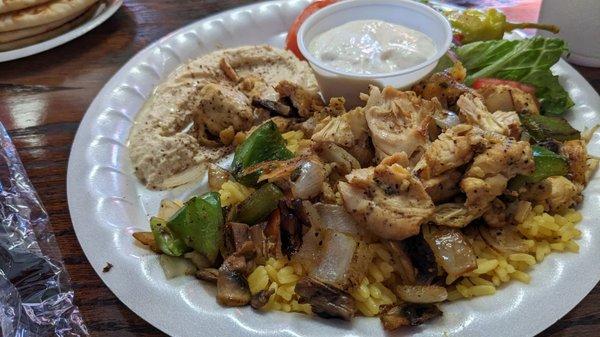 Chicken Zorba which is grilled chicken, green peppers, onion, mushrooms on a bed of rice