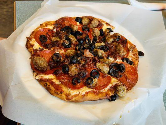 Pizza- sausage, pepperoni, olives, and bacon