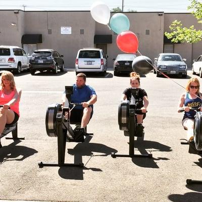 Rowing on the rowing machines.