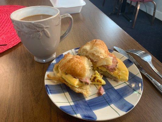 Coffee with a ham egg and cheese croissant