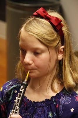 A 4th grader learning to play the oboe.