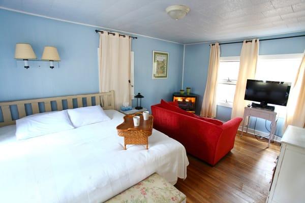 Cottage 2 features a king bed, twin sofa bed, and fully equipped kitchen.