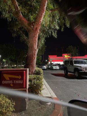 Entrance of drive thru. Long lines for inside and drive thru