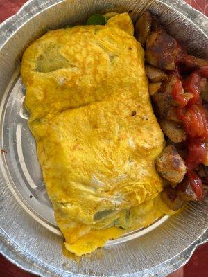 Omelette with spinach, grilled onion, sausage, sun dried tomatoes and home fries