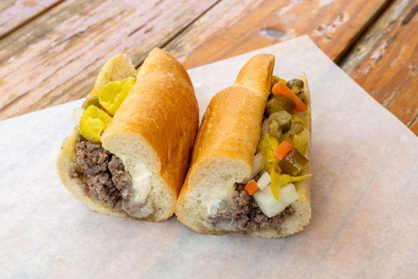 The Original Denver Chopped Cheese! Ground beef, topped with onions, pepperoncini, and mayo, served on a buttered hoagie roll!