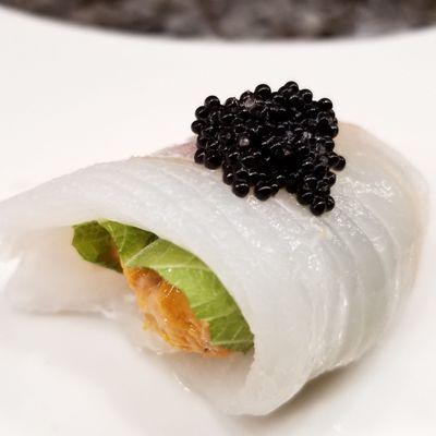 Sea urchin rolled in white fish with caviar