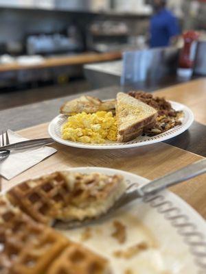 Waffle (single) Cheese 'n Eggs hash brown smothered Covered and Capped white toast.