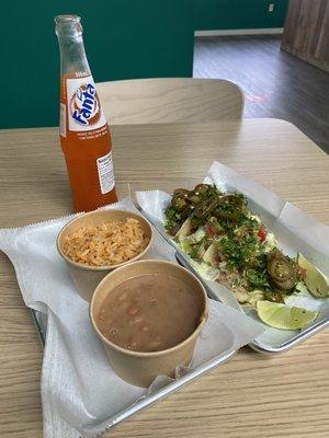 Corn tortilla tacos, beans & rice with Fanta